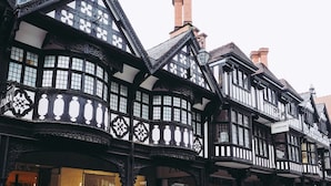 A traditional half-timbered building with a shop on the ground floor. - The Lombard House - City Centre (Chester)