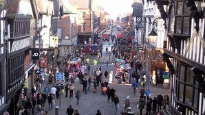 A bustling medieval street with narrow pathways and traditional timber-framed buildings. - The Racecourse Gathering 5 Bed - Sleeps 12 City Centre (Chester)