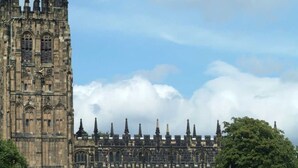 A historic building with Gothic architecture, featuring pointed arches and a series of spires. - Wrexham Central Stay Apartment Seven (Wrexham)