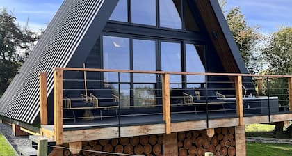 Stunning Scandinavian A Frame lodge with outside bathtub