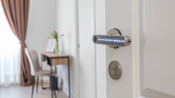 A modern door with a digital lock and a keyhole. - Rhome Vatican Rooms (Rome)