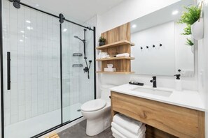 Shower, hair dryer, towels, soap