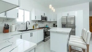 Coffee/tea maker, fridge, microwave, oven
