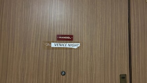 A wooden door with a nameplate reading "HANDEL" and a sign that says "VENICE NIGHT". - VENICE NIGHT 13 QUADRUPLA SHARED TOILETD (Mestre)
