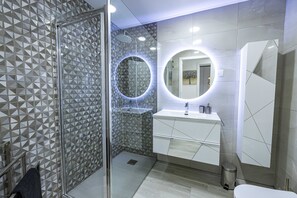 Shower, hair dryer, towels, soap