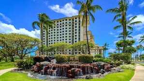 A hotel with a large building, a central water feature, and surrounding greenery. - Beach Villas at Ko Olina by KBM (Kapolei)