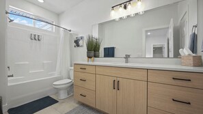 Shower, hair dryer, towels, shampoo