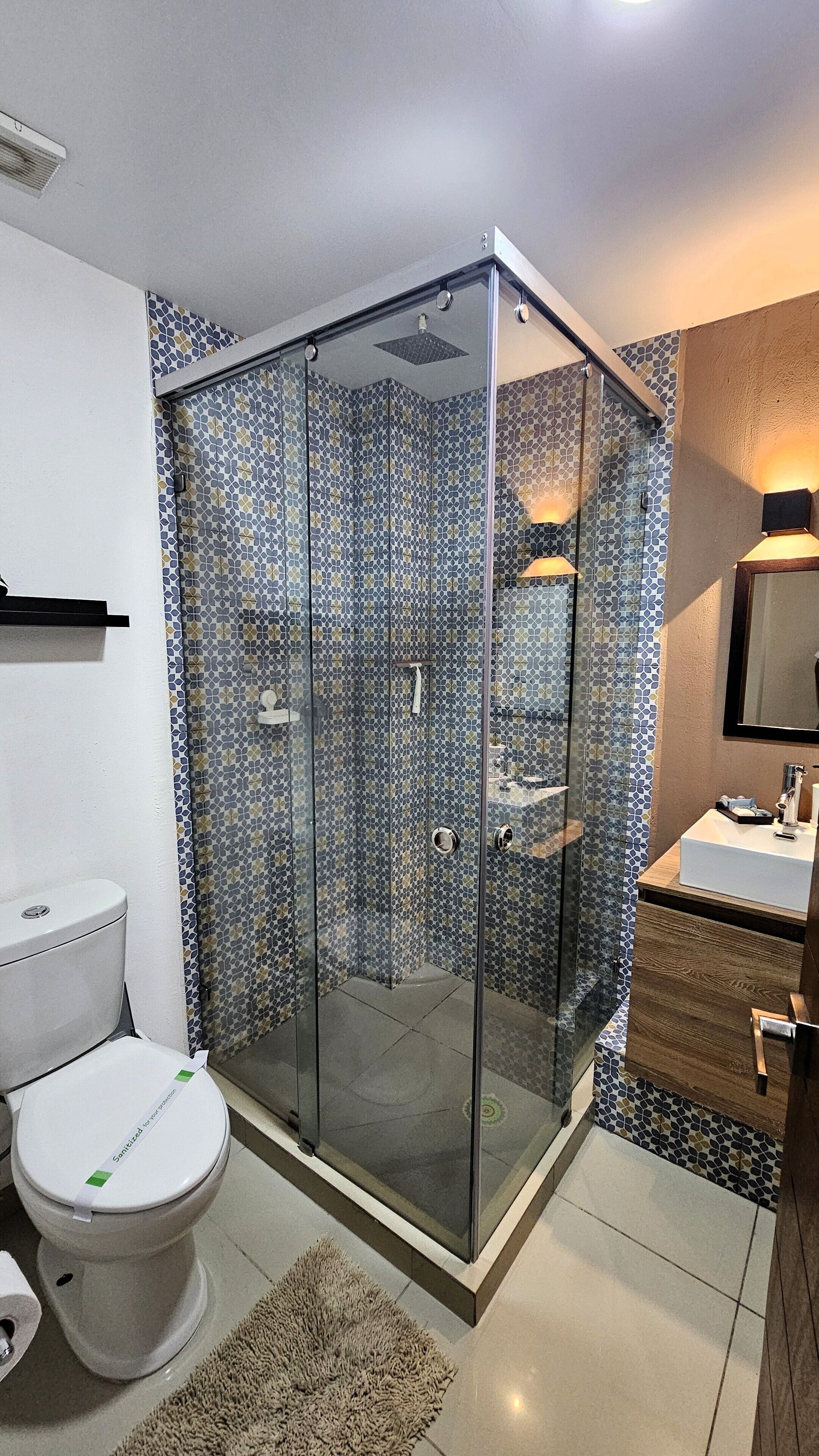 Shower, rainfall showerhead, designer toiletries, towels