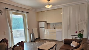 Condo, 1 Bedroom, Terrace, Garden View | Living area | Books - Guest Apartment Within a Villa in Lagonissi (Kalyvia Thorikou)