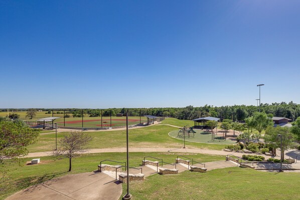 A park with a baseball field, walking paths, and a playground.