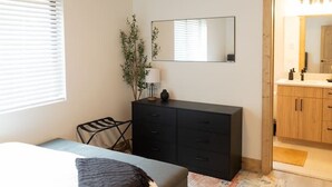 A bedroom with a bed, a dresser, a mirror, and a ceiling fan. - NEW Mountain Modern Cabin (Unit 4) (Island Park)