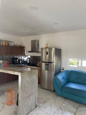 Full-sized fridge, coffee/tea maker, rice cooker, blender