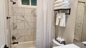 Hair dryer, towels, soap, shampoo