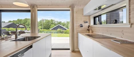 Fridge, stovetop, dishwasher, coffee/tea maker