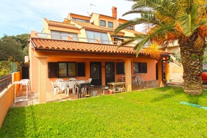 Relax on the patio amidst lush surroundings and enjoy the view from the balcony.