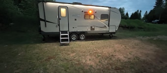 Cozy couples camper with your own private 100ft lake front.