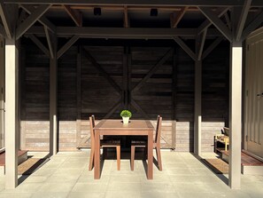 Outdoor dining - Off Grid Country Cabins: 1 Double Bed in Each Cabin (Waitoki)
