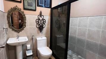 Shower, free toiletries, slippers, towels