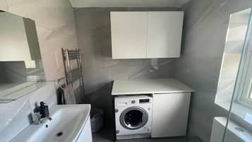 Shower, hair dryer, towels