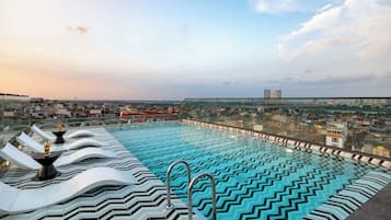Outdoor pool, open 8:00 AM to 10:00 PM, pool umbrellas, pool loungers