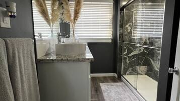 Shower, hair dryer, towels, soap