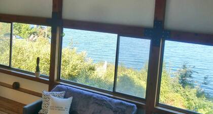 Experience the PNW in a cabin on Hood Canal with water and mountain views.