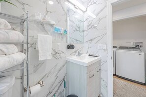Shower, hair dryer, towels, soap