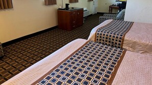 A hotel room with two beds, a TV, a desk, and a chair. - Stay Inn by OYO Near I 80 Lincoln West (Lincoln)