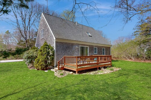 2-story home near the beach with large lawn, deck, W/D, streaming, & partial AC