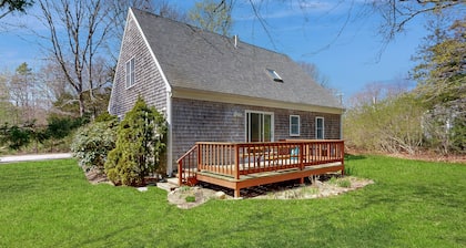 2-story home near the beach with large lawn, deck, W/D, streaming, & partial AC