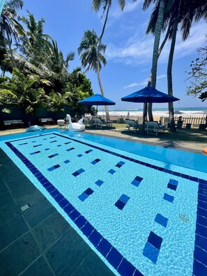 Outdoor pool, pool umbrellas, sun loungers