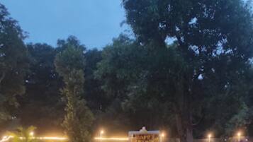 Deluxe Double Room, Multiple Beds, City View | Garden view