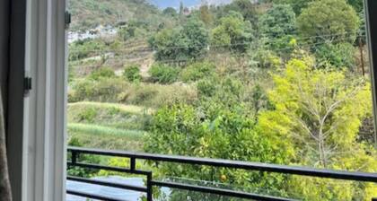 An independent Cottage with mountain view and 10 minutes walk from the lake.