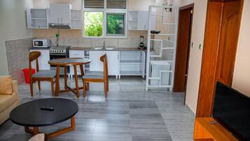 Deluxe Double Room | Living area | TV