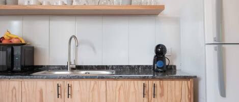 Coffee/tea maker, microwave, toaster, cookware/dishes/utensils