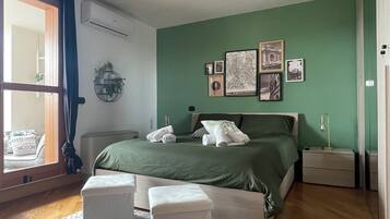 1 bedroom, desk, iron/ironing board, travel crib