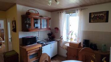 Fridge, microwave, stovetop, coffee/tea maker