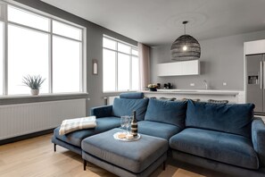 Apartment, 3 Bedrooms | Living area | 50-inch Smart TV with digital channels