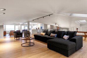 Apartment, 4 Bedrooms | Living area | 50-inch Smart TV with digital channels