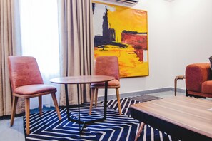 Executive Room | Living area | 32-inch Smart TV with satellite channels