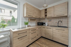 House, 2 Bedrooms, Kitchen | Private kitchen | Microwave, dishwasher, coffee/tea maker, electric kettle - Beautiful House With Garden by Renters (Kolobrzeg)