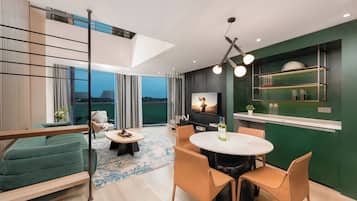 Deluxe Apartment, 1 Bedroom (Loft) | Living area | 55-inch LCD TV with cable channels
