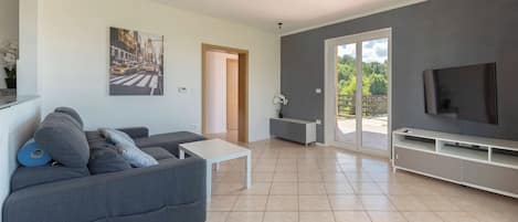 Honeymoon Apartment, Multiple Bedrooms, Mountainside (Serene Retreat Apartment Martin) | Living area | 21-inch flat-screen TV with digital channels, TV