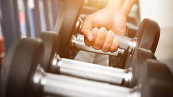 A hand gripping a dumbbell.