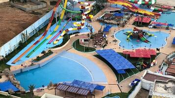 Enjoy water slides and pools surrounded by residential buildings.