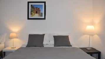 1 bedroom, desk, iron/ironing board, travel crib