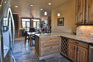 Enjoy cooking in this well-equipped kitchen with a large island and modern appliances.