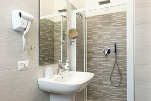 Eco-friendly toiletries, hair dryer, bidet, towels