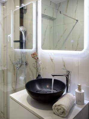 Shower, hair dryer, towels, soap