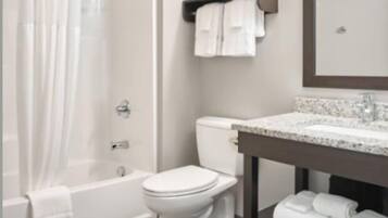 Suite Deluxe, 1 habitación, cocina | Baño | Tina con regadera, amenidades de baño gratuitas, secadora de cabello